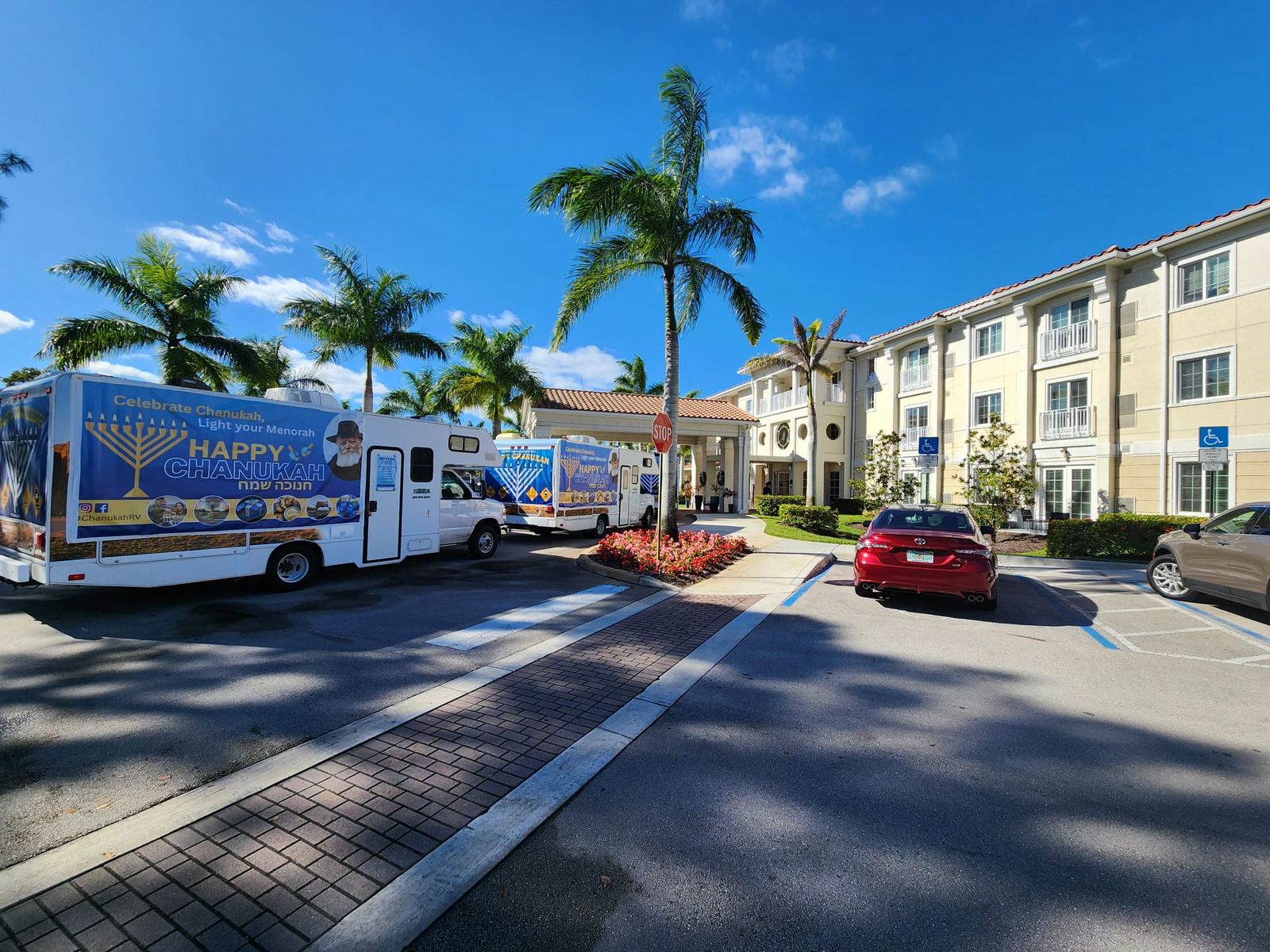 Mitzvah Tank Fleet parked at a senior community with palm trees
